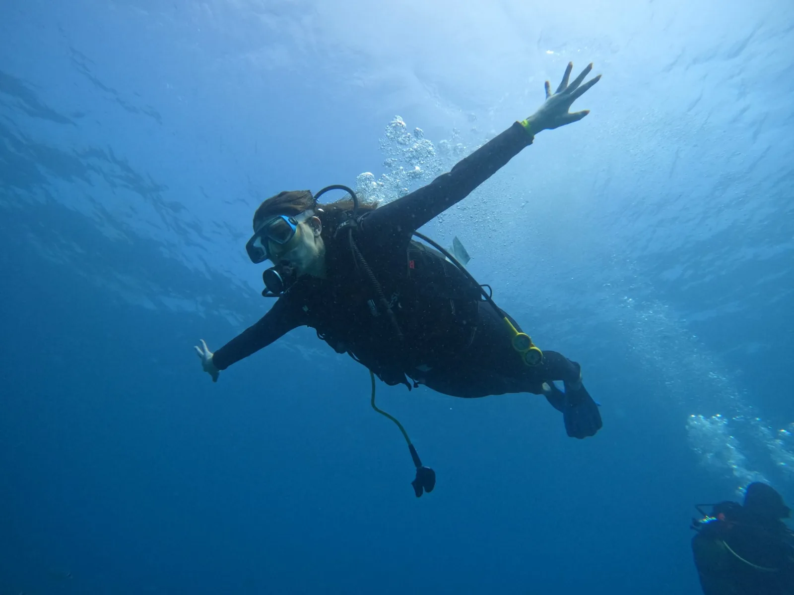 diver waving deep blue
