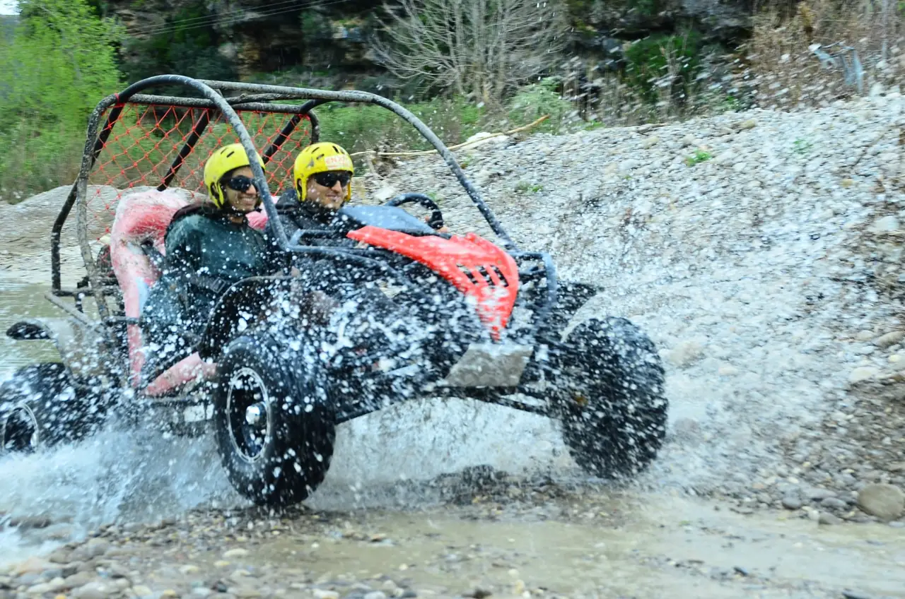 Buggy crossing a rocky river section on the Belek off-road route