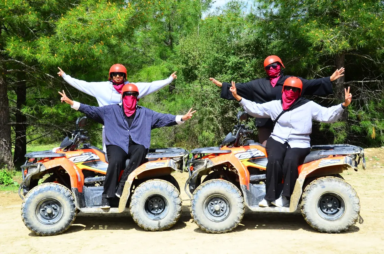 Quad safari group stopping for photos beside the trail near Belek