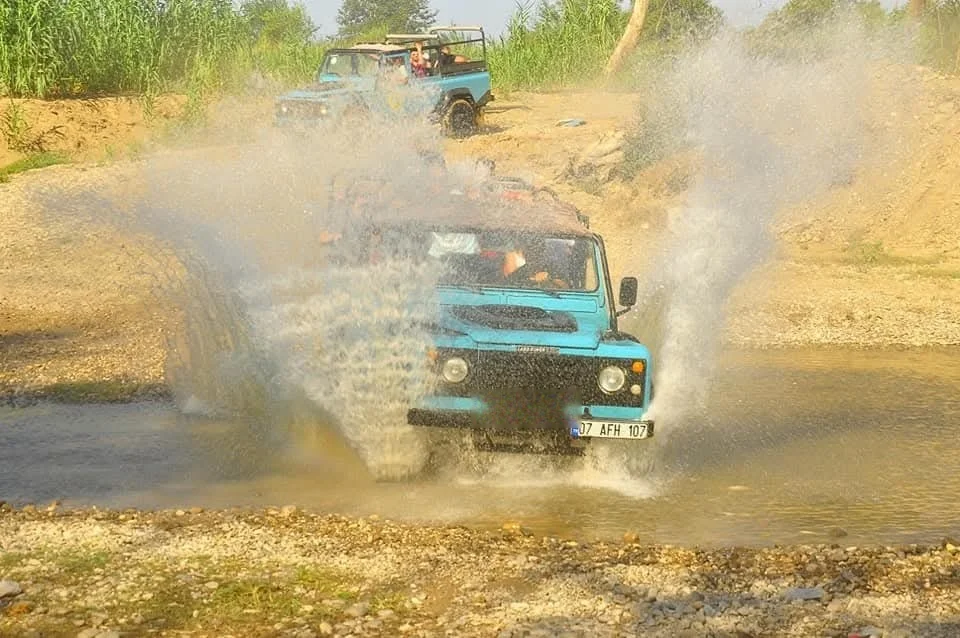 Jeep convoy crossing a river on the Side jeep safari