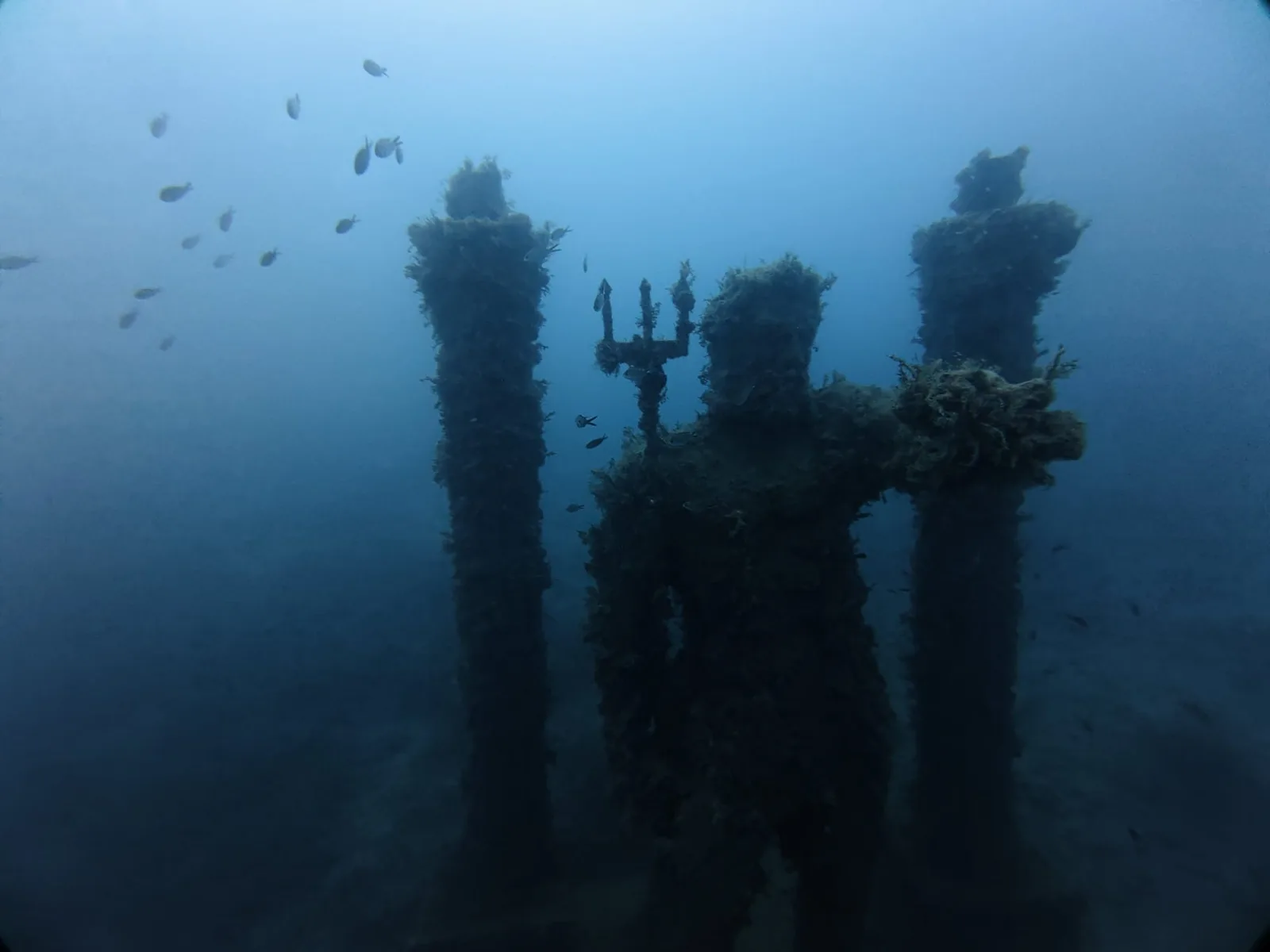 poseidon trident statues silhouette side